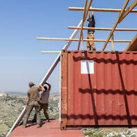A temporary housing unit being built from shipping containers at the Chavat Meir La’Aretz outpost in the West Bank, March 12, 2026. (Dor Pazuelo/Flash90)