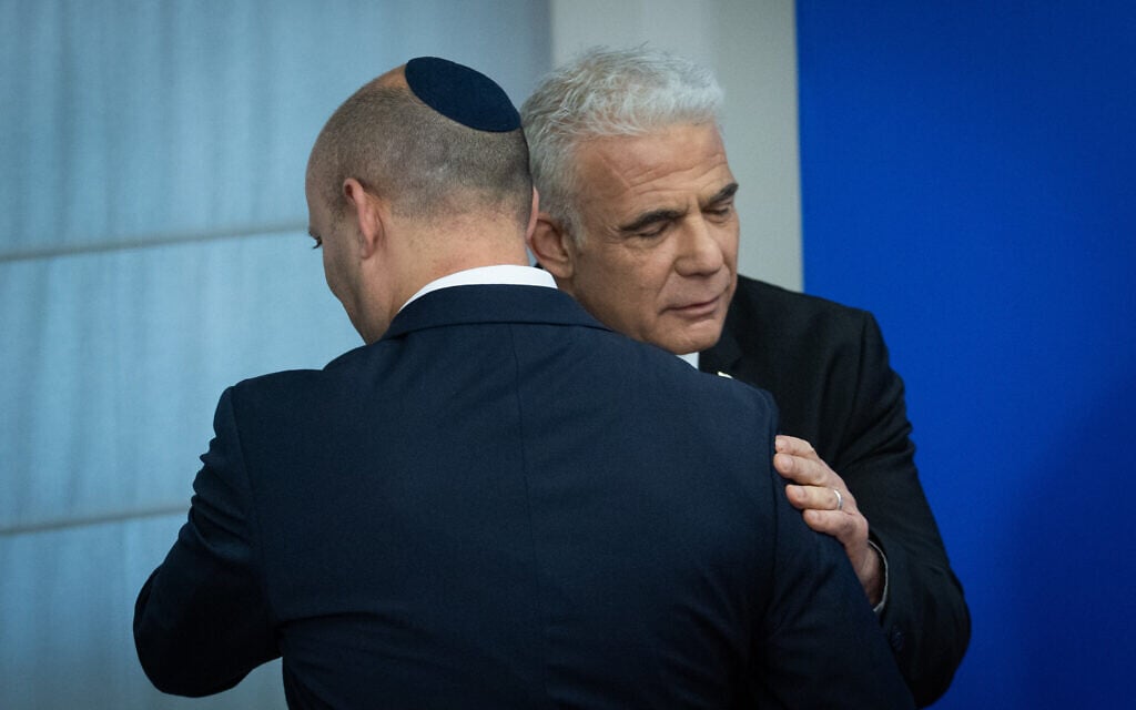 Chairman of the Yahad party former Prime Minister Naftali Bennett, left with former prime minister Yair Lapid during a press conference at the Knesset in Jerusalem, May 20, 2026. (Yonatan Sindel/Flash90)