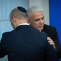Chairman of the Yahad party former Prime Minister Naftali Bennett, left with former prime minister Yair Lapid during a press conference at the Knesset in Jerusalem, May 20, 2026. (Yonatan Sindel/Flash90)