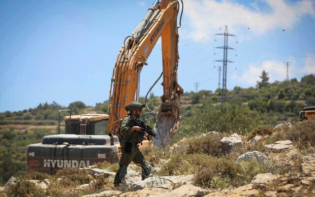 Illustrative: Israeli security forces guard while bulldozers demolish a home in the town of Nahalin, West Bank, May 25, 2026. (Wisam Hashlamoun/Flash90) Illustrative: Israeli security forces guard while bulldozers demolish a home in the town of Nahalin, West Bank, May 25, 2026. (Wisam Hashlamoun/Flash90)