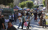 Palestinians shop at a market ahead of the Eid al-Adha festival, in the West Bank city of Hebron, on May 26, 2026. (Wisam Hashlamoun/Flash90)