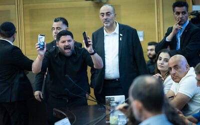 Almog Cohen, of the Otzma Yehudit party, disrupts an event about settler violence, in the Knesset in Jerusalem, June 2, 2026. (Yonatan Sindel/Flash90)
