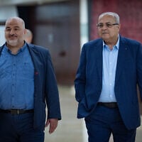 Ra'am party leader Mansour Abbas (left) and Ta'al chief Ahmad Tibi walk outside the office of Prime Minister Benjamin Netanyahu at the Knesset, June 3, 2026. (Yonatan Sindel/Flash90)