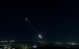 Israeli air defense system fire to intercept incoming ballistic missiles launched from Iran, as seen over northern Israel, June 7, 2026. (Ayal Margolin/Flash90)