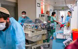 Medical staff relocate NICU babies to an underground parking area converted into a treatment ward at Tel Aviv Sourasky Medical Center in Tel Aviv, after missile fire from Iran, June 8, 2026. (Avshalom Sassoni/Flash90)
