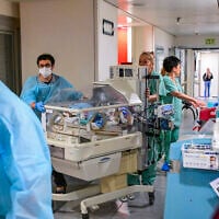 Medical staff relocate NICU babies to an underground parking area converted into a treatment ward at Tel Aviv Sourasky Medical Center in Tel Aviv, after missile fire from Iran, June 8, 2026. (Avshalom Sassoni/Flash90)