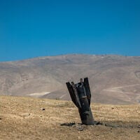 Part of an Iranian ballistic missile is seen in the desert near Jericho in the West Bank after being fired toward Israel from Iran, June 8, 2026 (Chaim Goldberg/Flash90)