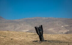 Part of an Iranian ballistic missile is seen in the desert near Vered Yeriho in the West Bank after being fired toward Israel from Iran, June 8, 2026 (Chaim Goldberg/Flash90)