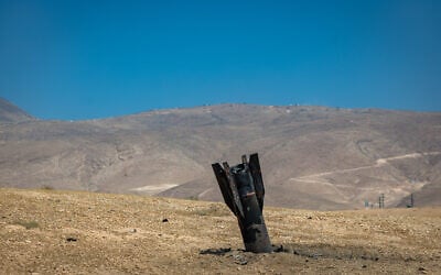 Part of an Iranian ballistic missile is seen in the desert near Jericho in the West Bank after being fired toward Israel from Iran, June 8, 2026 (Chaim Goldberg/Flash90)