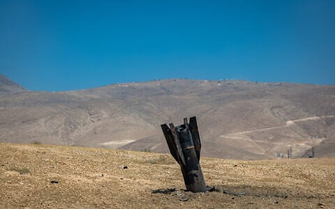 Part of an Iranian ballistic missile is seen in the desert near Vered Yeriho in the West Bank after being fired toward Israel from Iran, June 8, 2026 (Chaim Goldberg/Flash90)