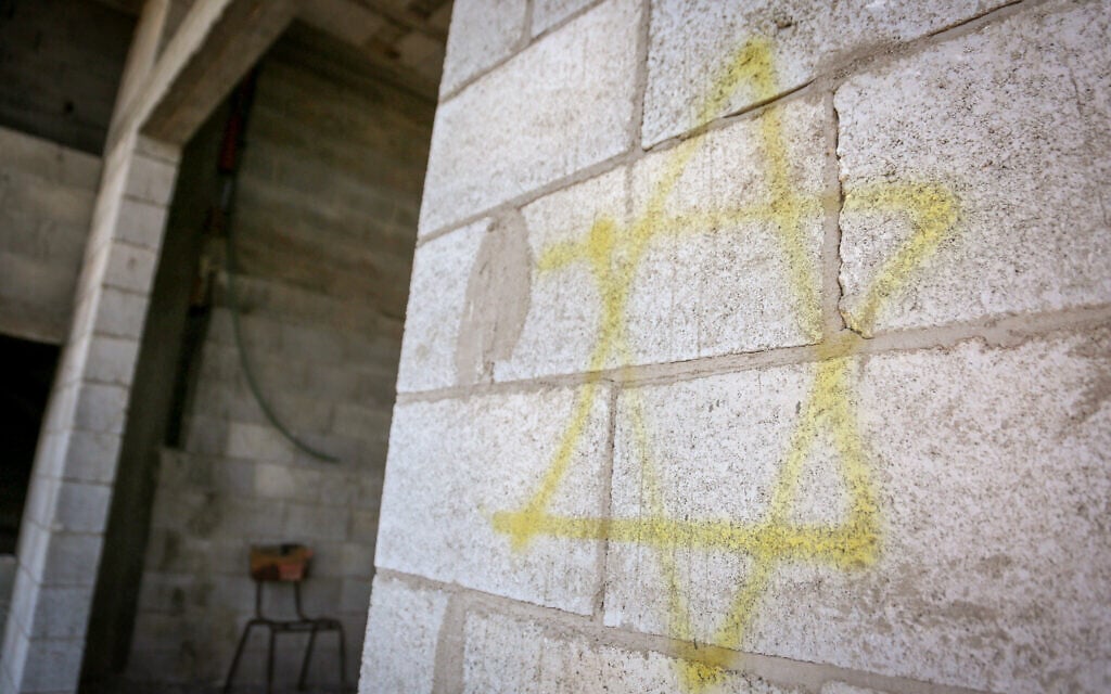 A yellow Star of David graffited in an apparent settler arson attack in
of Beit Ummar, north of Nablus in the West Bank on June 9, 2026 (Nasser Ishtayeh/Flash90)
