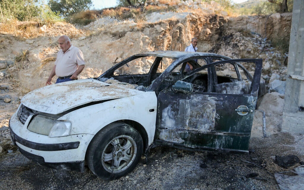 Palestinians inspect a burned house and car after an attack by settlers in
Beit Ammar, north of Nablus in the West Bank on June 9, 2026 (Nasser Ishtayeh/Flash90)