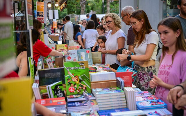 People visit the opening of the 100th Hebrew Book Week at Sarona in Tel Aviv, June 10, 2026. (Avshalom Sassoni/Flash90) People visit the opening of the 100th Hebrew Book Week at Sarona in Tel Aviv, June 10, 2026. (Avshalom Sassoni/Flash90)