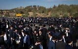 Ultra-Orthodox men block a highway between Jerusalem and Tel Aviv, on June 11, 2026. (Yonatan Sindel/Flash90)