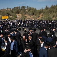 Ultra-Orthodox men block a highway between Jerusalem and Tel Aviv, on June 11, 2026. (Yonatan Sindel/Flash90)