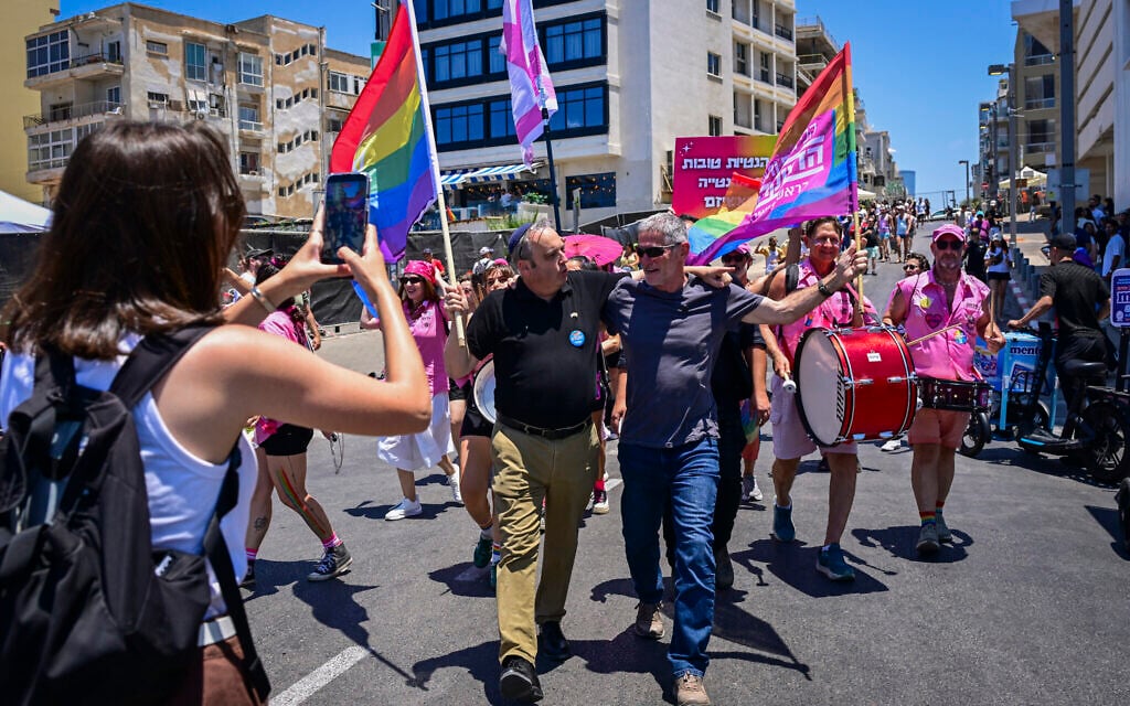 Democrats chair Yair Golan (right) and MK Gilad Kariv attend the annual LGBTQ Pride Parade in Tel Aviv, June 12, 2026. (Avshalom Sassoni/Flash90)