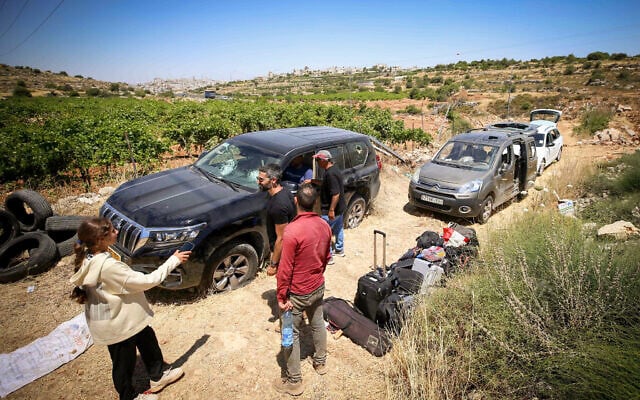 People survey damage caused to Palestinian vehicles by violent settlers who attacked a group of Palestinians and Jewish activists near Halhul, in the Hebron area of the West Bank, on June 15, 2026. (Wisam Hashlamoun/Flash90) People survey damage caused to Palestinian vehicles by violent settlers who attacked a group of Palestinians and Jewish activists near Halhul, in the Hebron area of the West Bank, on June 15, 2026. (Wisam Hashlamoun/Flash90)