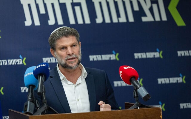 Finance Minister Bezalel Smotrich speaks ahead of a Religious Zionism faction meeting at the Knesset, June 15, 2026. (Yonatan Sindel/Flash90)