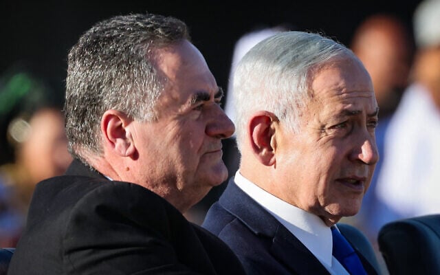 Defense Minister Israel Katz (left) and Prime Minister Benjamin Netanyahu attend the graduation ceremony of an IDF officers’ course in southern Israel, June 25, 2026. (Flash90)