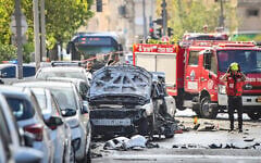 Police and rescue forces at the scene where a car exploded in a suspected gangland killiing, in Jaffa, June 28, 2026. (Avshalom Sassoni/Flash90)