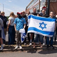 Pro-Israel counter-protesters face the main protest against the Great Israeli Real Estate Event at Edgware United Synagogue on June 14, 2026 in London. (Denise Baker/Getty Images via JTA)