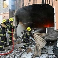 Firefighters work to extinguish a fire caused by a debris from intercepted Iranian drones in Manama, Bahrain, June 11, 2026. (Bahrain Interior Ministry)