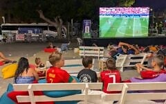 Israeli kids watch a World Cup match between Portugal and Uzbekistan at an outdoor screening in Jaffa, June 23, 2026. (Deborah Danan/ JTA)