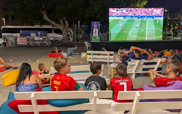Israeli kids watch a World Cup match between Portugal and Uzbekistan at an outdoor screening in Jaffa, June 23, 2026. (Deborah Danan/ JTA)