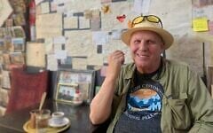 Marcus James enjoys his coffee at Café Al Mufti in the Muslim Quarter of Jerusalem's Old City, May 2026.(Sarah Tuttle-Singer)