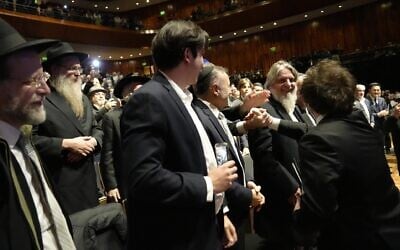 Argentina's president, Javier Milei, right, greets attendees at a major Chabad event in Buenos Aires, June 8, 2026. (Nicolas Kremenchusky for Chabad Lubavitch Argentina via JTA)
