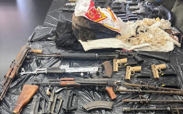 Weapons seized by the IDF and police during an attempted cross-border smuggling from Jordan, on June 12, 2026. (Israel Police) Weapons seized by the IDF and police during an attempted cross-border smuggling from Jordan, on June 12, 2026. (Israel Police)