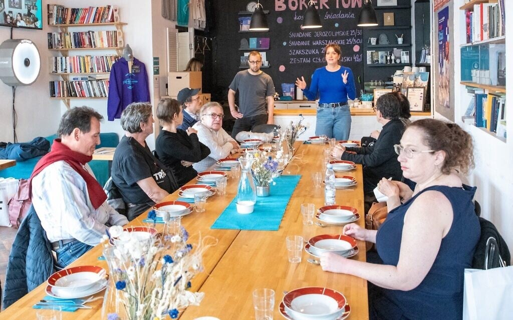 Participants in the Miszpucha Foundation trip for Polish Jewish emigrants and their descendants have lunch at the Jewish Community Center in Warsaw, Poland. (Adam de Kaminski via JTA)