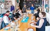 Participants in the Miszpucha Foundation trip for Polish Jewish emigrants and their descendants have lunch at the Jewish Community Center in Warsaw, Poland. (Adam de Kaminski via JTA)