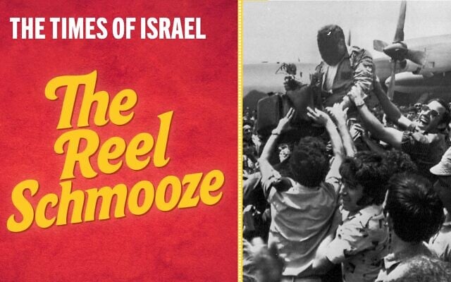 A cheering crowd at Tel Aviv's Ben-Gurion Airport raises a member of the rescue squad that freed the hijacked hostages from Uganda earlier in the day, July 4, 1976. In the background is the C-130 transport plane that took part in the raid. The rescuer's face is obscured for security reasons. (AP Photo/Pool)