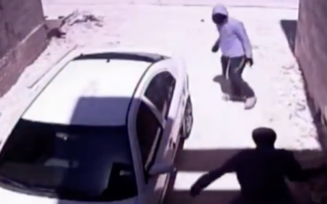 Footage from the northern West Bank town of Nablus, timestamped late morning on June 6, 2026, shows Jewish assailants vandalizing a parked car. (Screen capture: X, used in accordance with Clause 27a of the Copyright Law)