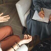 Illustrative: A patient and psychologist (Stock photo/Fiordaliso via JTA)