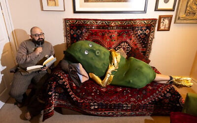 Jewish Culture Month mascot Mr. Pickle hops onto the psychotherapy couch at the event launch party in London, May 2026. (Sophie Shaw)