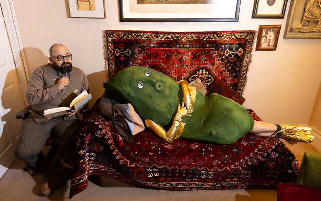 Jewish Culture Month mascot Mr. Pickle hops onto the psychotherapy couch at the event launch party in London, May 2026. (Sophie Shaw)