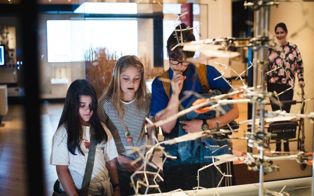 A family views an exhibit at London's Science Museum that's part of Jewish Culture Month, summer 2026. (Sophie Shaw)