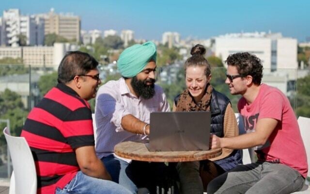 Students discussing their environmental projects on the rooftop of the New Environmental School's Ecobuilding Students discussing their environmental projects on the rooftop of the New Environmental School's Ecobuilding