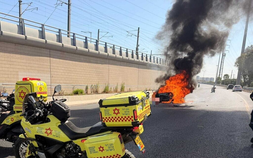 The aftermath of a suspected car bombing, which killed one person, on central Israel's Ayalon Highway near Holon, June 4, 2026. (Magen David Adom)