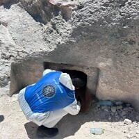 An Israel Police officer at the entrance to a suspected terror tunnel running from the area of A'zaim checkpoint in the West Bank toward Israel, in an image released on June 24, 2026. (Israel Police)
