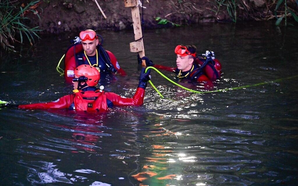 Fire and Rescue Service personnel search the area where two girls went missing, with one later found dead, at the Jordan River in northern Israel, June 27, 2026, (Fire and Rescue Service)