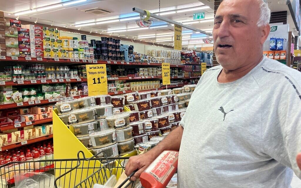 Arie Zino shops at Souq Faisal in the town of Mazra'a, outside Nahariya, on June 8, 2026. (Diana Bletter/Times of israel)