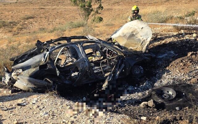 A car that veered off a highway after catching fire, killing both passengers in southern Israel on June 1, 2026. (Fire and Rescue Service)