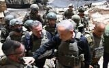 This handout photo shows Prime Minister Benjamin Netanyahu greeting IDF troops in southern Lebanon, June 30, 2026. (Haim Zach/GPO)