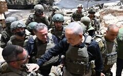 This handout photo shows Prime Minister Benjamin Netanyahu greeting IDF troops in southern Lebanon, June 30, 2026. (Haim Zach/GPO)