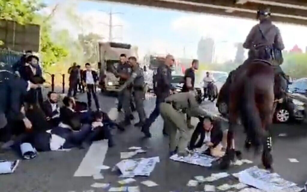 Police clash with Haredi protesters on Route 4, June 17, 2026 (Screen grab/Channel 13)