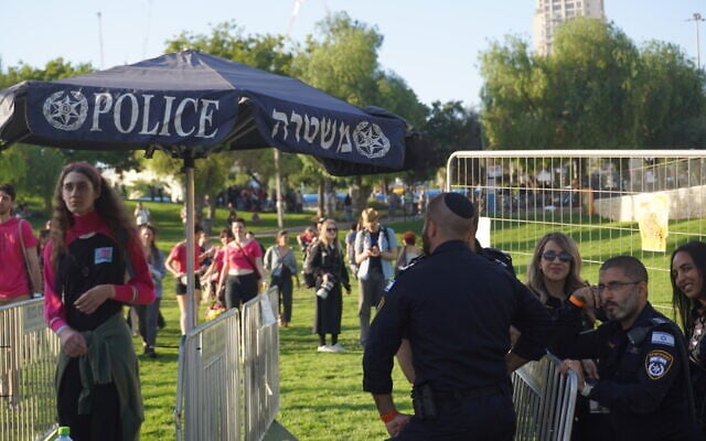 Officers man a police checkpoint set up at Sacher Park, the gathering point for the annual Pride March in Jerusalem on June 4, 2026. (Charlie Summers/Times of Israel)