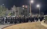Haredi men protest the arrest of draft dodgers on June 5, 2026. Location of the video is unclear. (Screen grab used in accordance with Clause 27a of the Copyright Law)